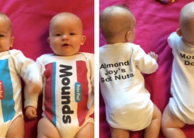 Infants in Almond Joy and Mounds outfits