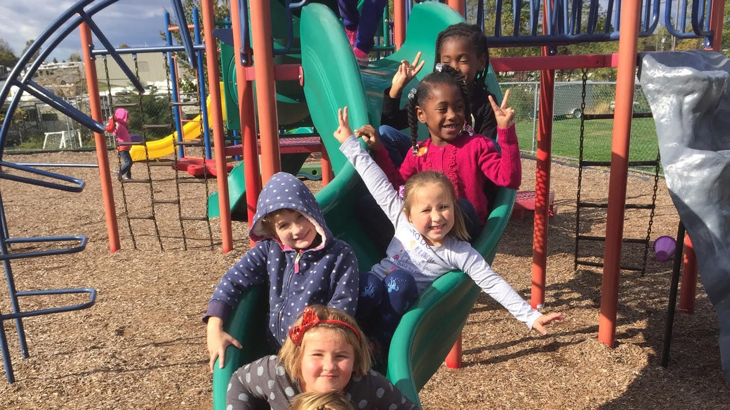 Children on green slide